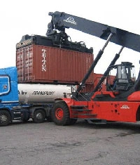 Dry container repair yard with stacked containers